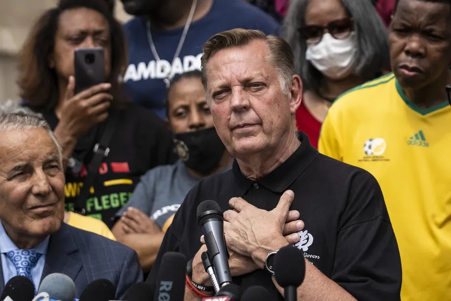Rev. Michael Pfleger speaks Monday outside his St. Sabina Church after it was announced that he will return to his role as senior pastor after being cleared of sexual abuse allegations. Ashlee Rezin Garcia/Sun-Times