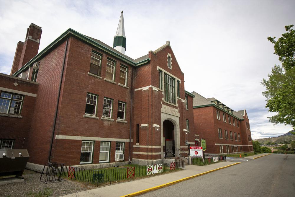 The former Kamloops Indian Residential School is seen on Tk'emlups te Secwépemc First Nation in Kamloops, British Columbia, Canada on Thursday, May 27, 2021. The remains of 215 children have been found buried on the site of the former residential school in Kamloops. (Andrew Snucins/The Canadian Press via AP)