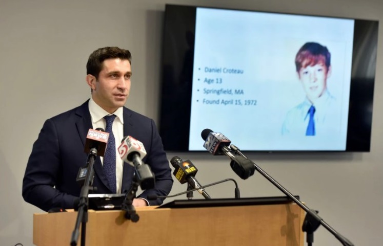 Hampden District Attorney Anthony Gulluni speaks at a press conference May 24 to say he had concluded the late former priest Richard Lavigne killed altar boy Daniel Croteau in 1972. A photo of Croteau is projected on the screen behind him. (Don Treeger / The Republican file photo)