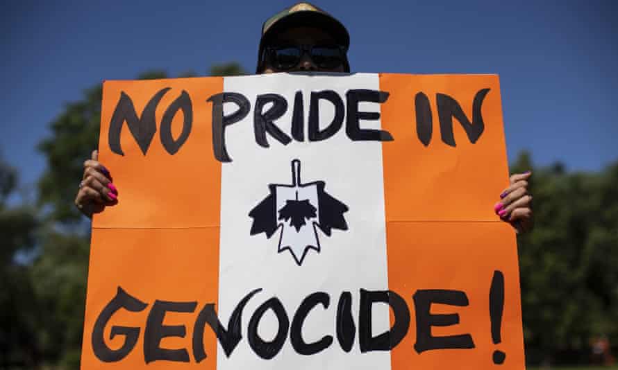 People march during an anti-Canada Day rally in Edmonton, Alberta. Photograph: Canadian Press/Rex/Shutterstock