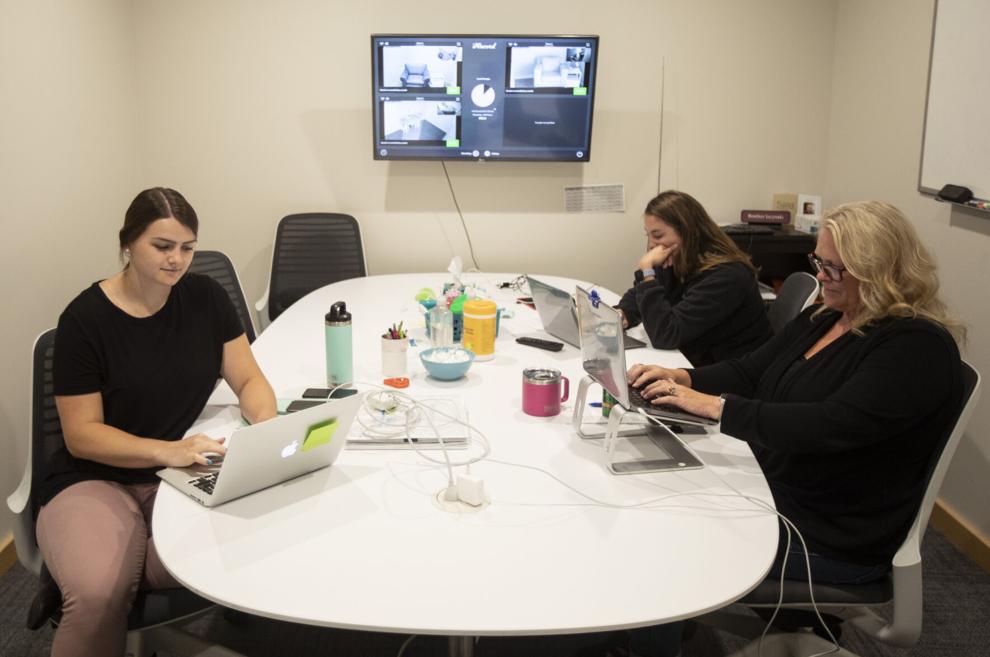 From left, intern Kayla Polk and Intervention Specialists Audrey Cornell and Heather Lucynski work at Traverse Bay Children’s Advocacy Center in Traverse City on Wednesday.  Record-Eagle / Mike Krebs