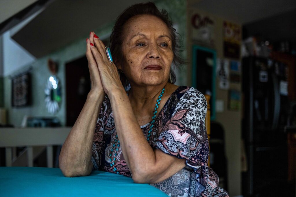 Bessie Smith, 79, was forbidden to speak her Navajo language once she began attending a federal boarding school, and she nearly forgot her native tongue. “It’s so casually taken away,” she said. “It’s like you are violated.”Credit...Sharon Chischilly for The New York Times