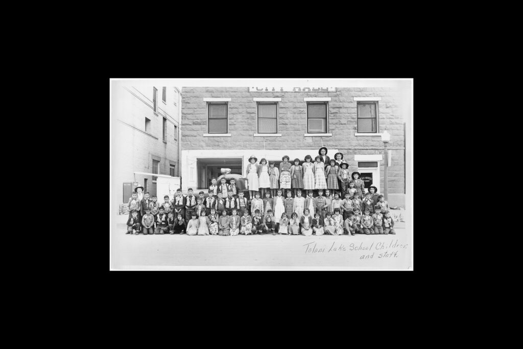 Tolani Lake School children and staff in an undated photograph.Credit...National Archives