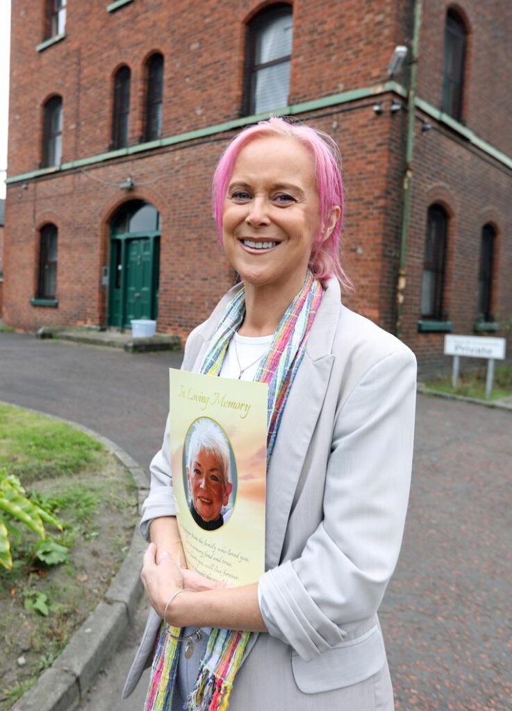 Sinead, holds a picture of her mother who sadly passed away before seeing her daughter receive justice