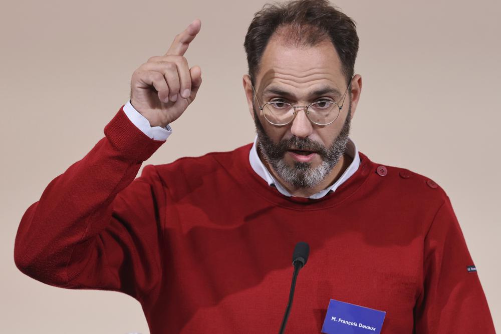 Francois Devaux, founder of victim association "La parole liberee", speaks during the publishing of a report by an independant commission into sexual abuse by church officials (Ciase), Tuesday, Oct. 5, 2021, in Paris. A major French report released Tuesday found that an estimated 330,000 children were victims of sex abuse within France's Catholic Church over the past 70 years, in France's first major reckoning with the devastating phenomenon. (Thomas Coex, Pool via AP)