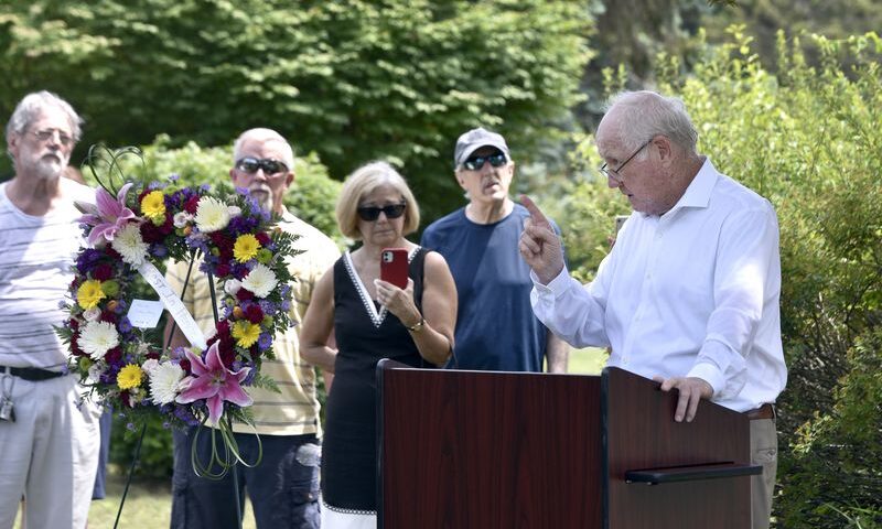 The Rev. James J. Scahill, right, a priest retired from the Roman Catholic Diocese of Springfield, speaks during June 28 graveside memorial service for Danny Croteau, the 13-year-old altar boy who authorities determined was killed by his parish priest, Richard Lavigne, in 1972. The service was held at the boy's grave in Hillcrest Cemetery in Springfield. Scahill, for the past 20 years, had been sounding the alarm about Lavigne and the questioning the diocese's handling of clergy sex abuse cases. (Don Treeger / The Republican File Photo)