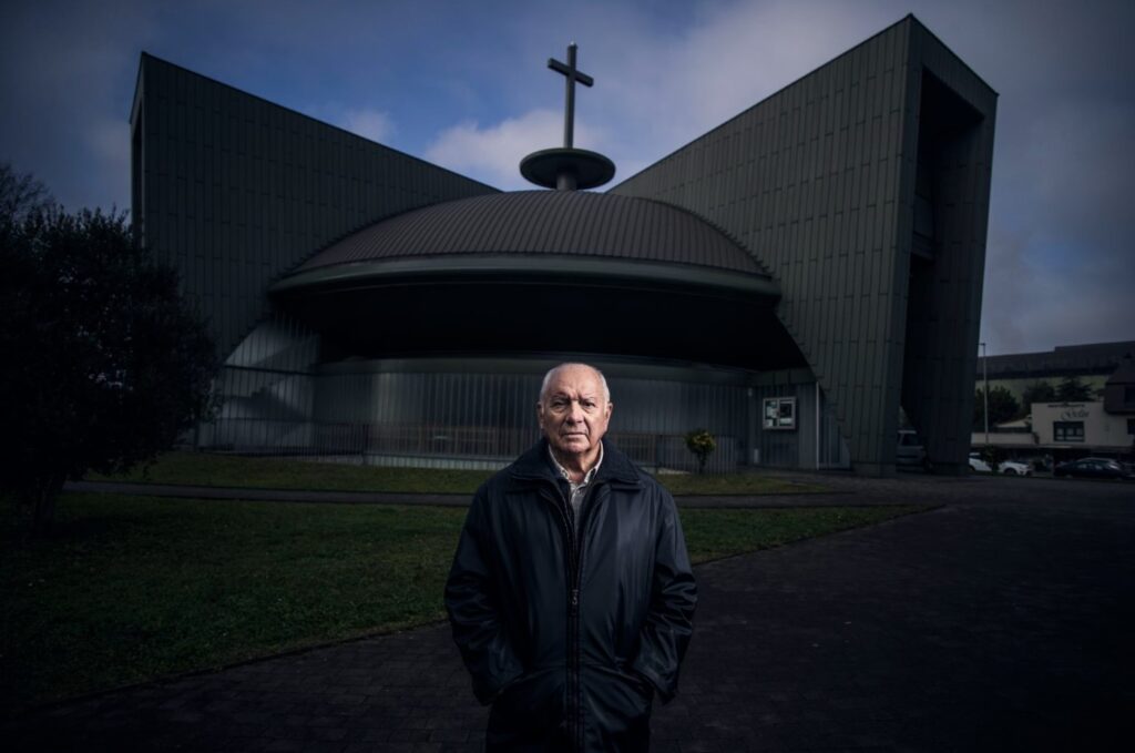 Jesús Gutiérrez, who denounces abuses in the old Augustinian school in Santander, one of the cases included in the EL PAÍS report, in front of a church in this city, in the Nueva Montaña neighborhood. Photo by Samuel Sanchez