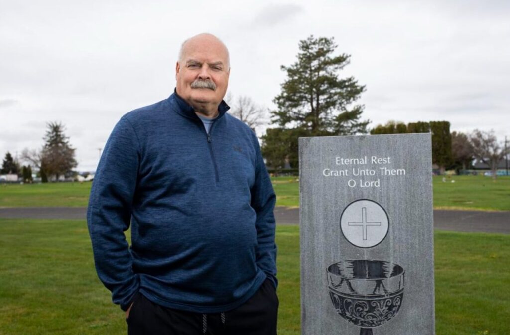 Michael Ross is pictured Saturday, April 30, 2022, in the area of Calvary Cemetery in Yakima, Wash., where the Rev. Joseph Sondergeld is buried. Evan Abell / Yakima Herald-Republic
