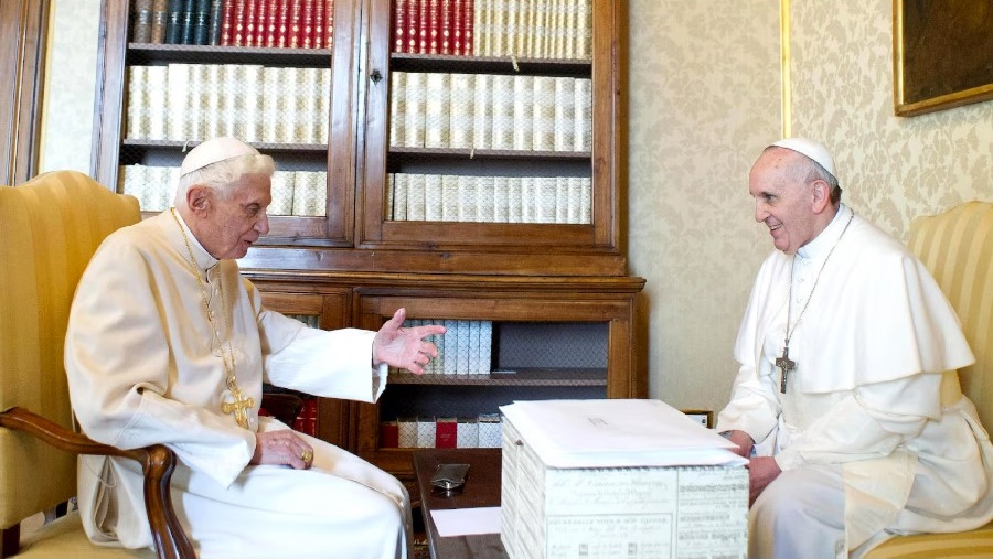 Francis (right) and Benedict at the papal summer residence with what is believed to be the box of scandal documents. Photograph: Vatican Pool