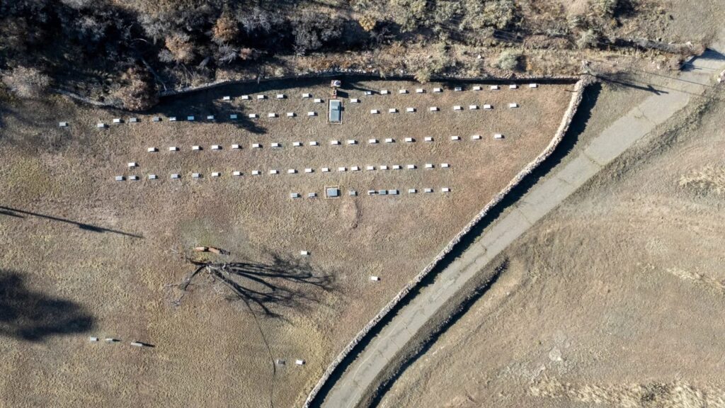 A drone photo of a graveyard at the old Via Coeli Monastery, where its founder, Father Gerald Fitzgerald, is buried. Nadav Soroker/Searchlight New Mexico