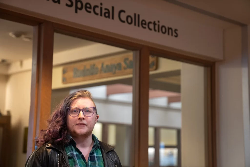 Avi Woontner, a library information specialist, at the entrance to the Center for Southwest Research and Special Collections at the University of New Mexico. Nadav Soroker/Searchlight New Mexico